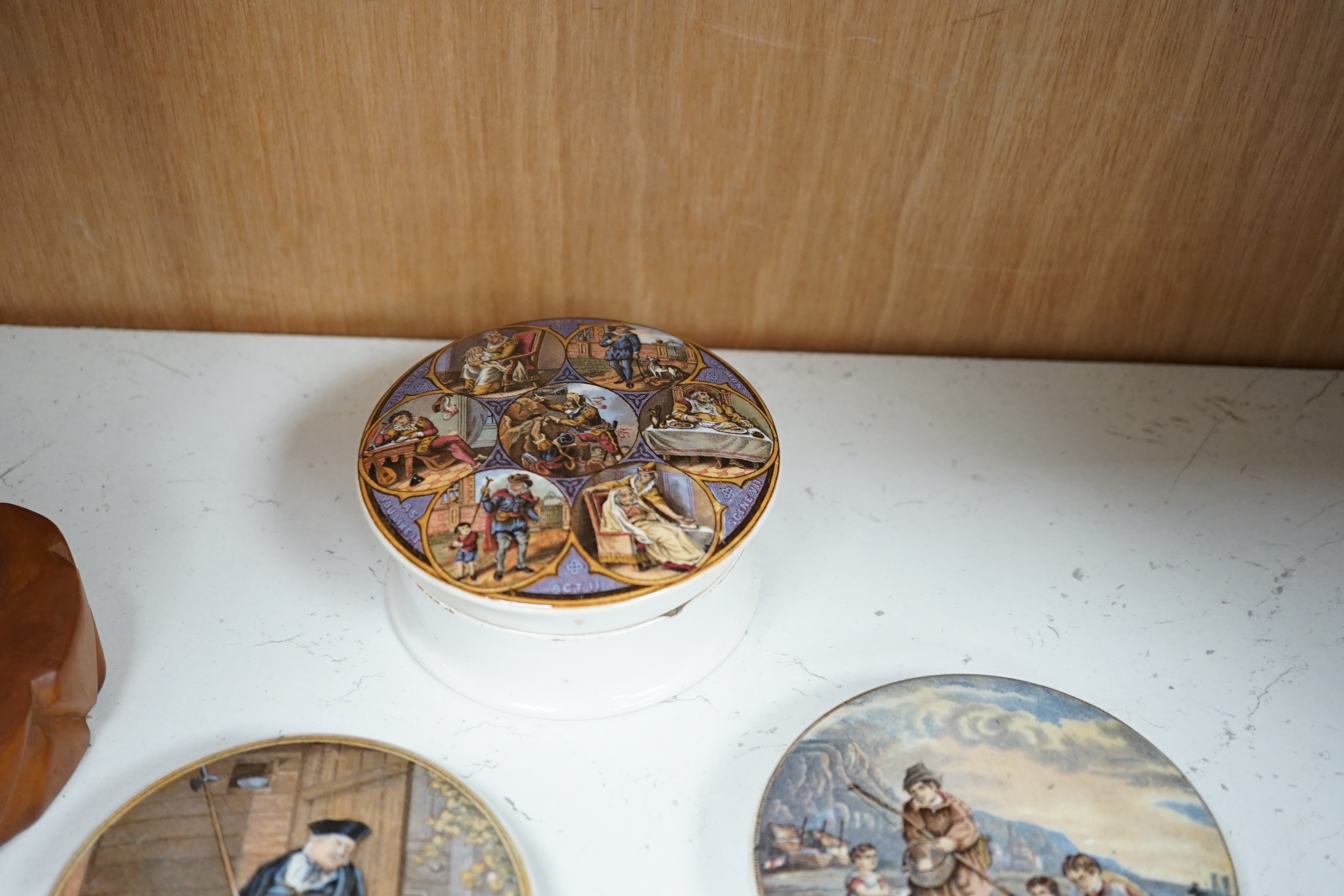 Eight Victorian ceramic Prattware pot lids, six with Shakespeare themes and a jar and cover, largest 12cm in diameter